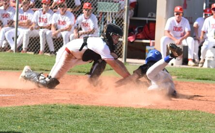 Spanish Fork catcher Trigg Cloward, left, tags out Pleasant Grove's Nash Clement at home plate in a Region 7 baseball game on Tuesday, April 7, 2026.